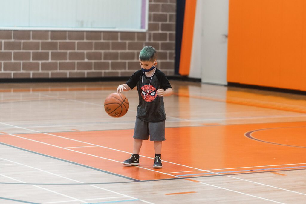 kid with basketball